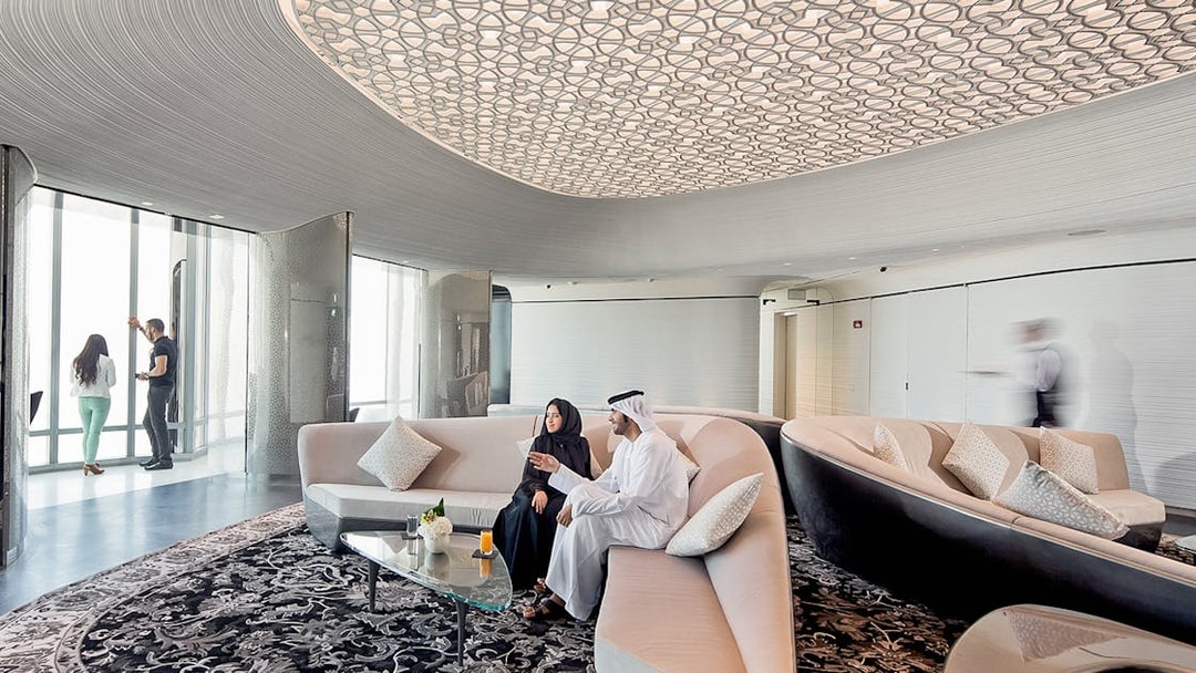 People relaxing with drinks at the lounge on level 148, Burj Khalifa, Dubai.