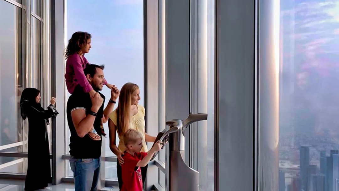 Visitors enjoying the view from Burj Khalifa's At The Top, Levels 124 and 125, Dubai.