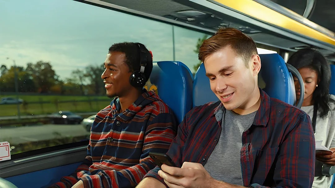 Passengers enjoying a Megabus ride to Niagara Falls.