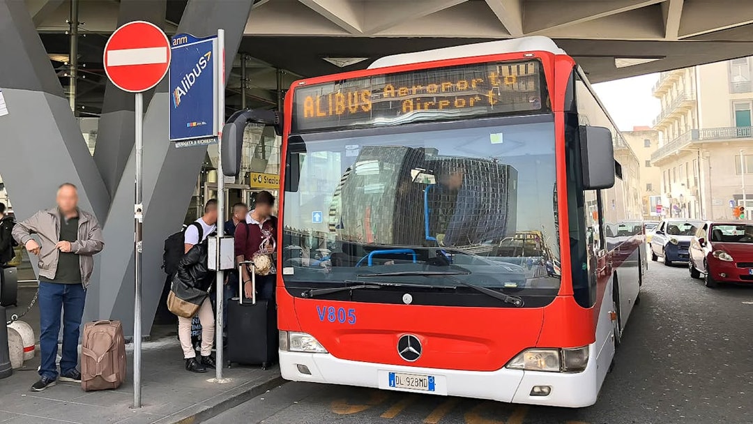 Alibus at Naples Capodichino Airport for transfer to Naples Maritime Station.