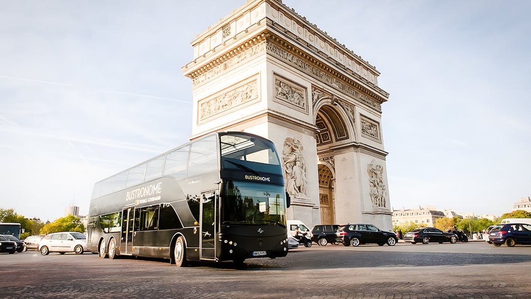 Bustronome Paris bus near Arc de Triomphe.