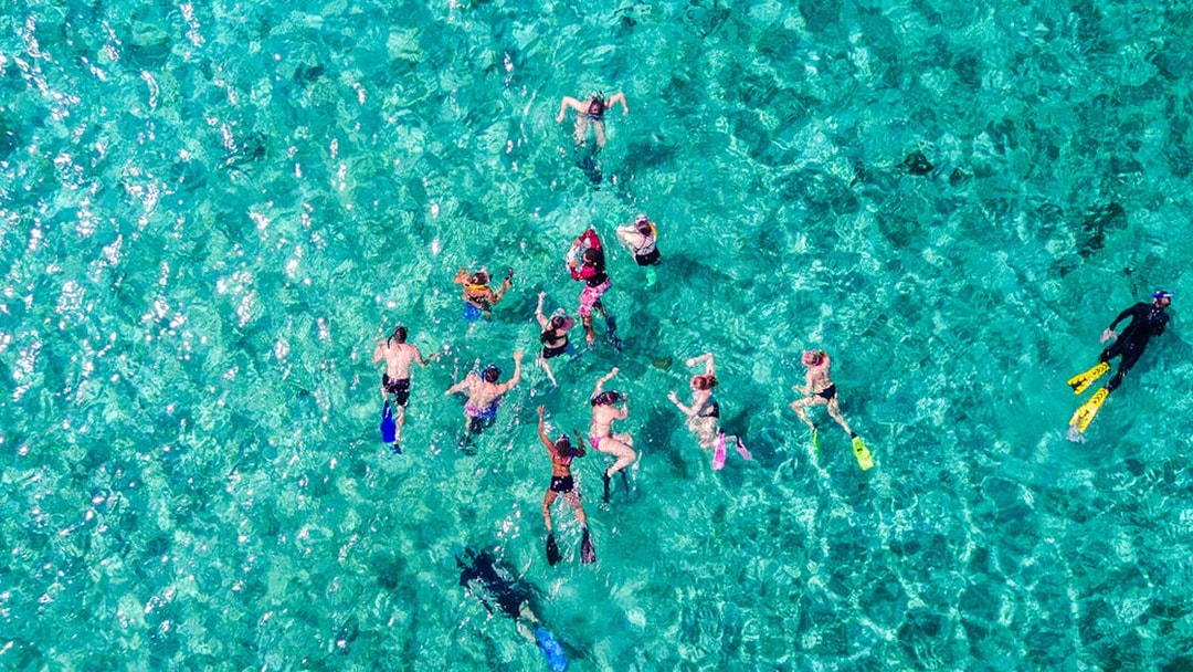 Snorkelers exploring clear waters on Langkawi Island Hopping Cruise.