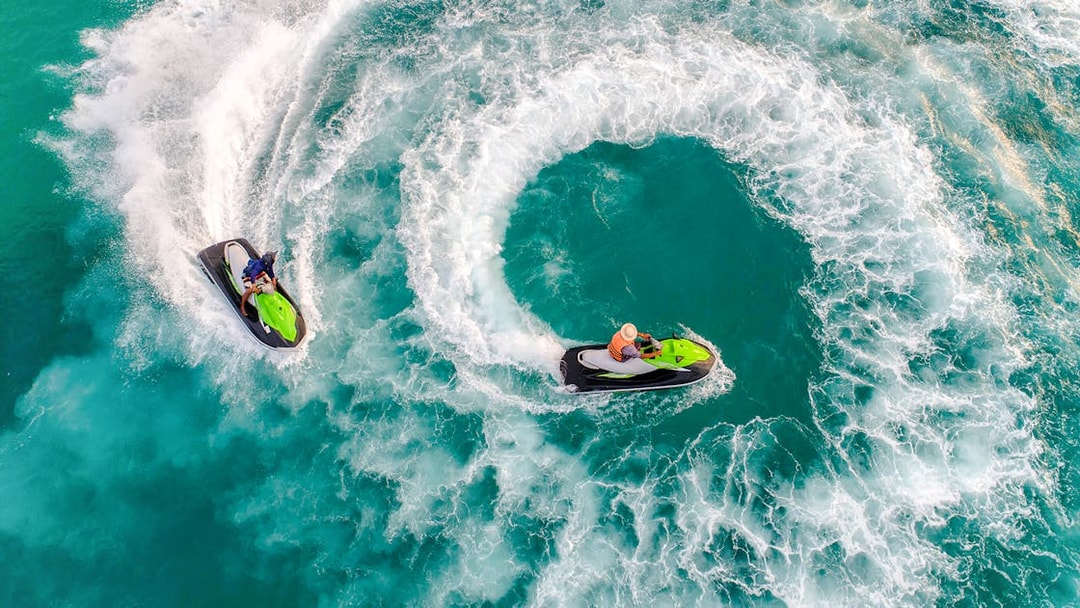 Group jet skiing on turquoise waters during Langkawi Island Hopping tour.