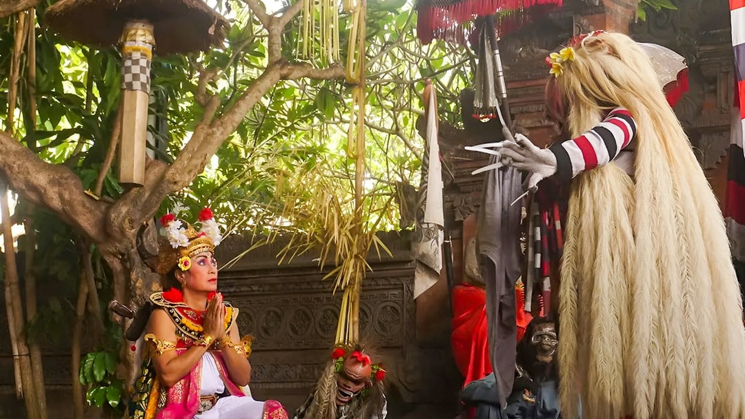 Performers in traditional costumes at Uluwatu Kecak Fire Dance Show, Bali.