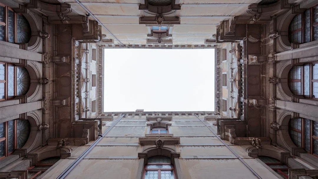 Ca' Rezzonico courtyard view from below, showcasing architectural details in Venice.