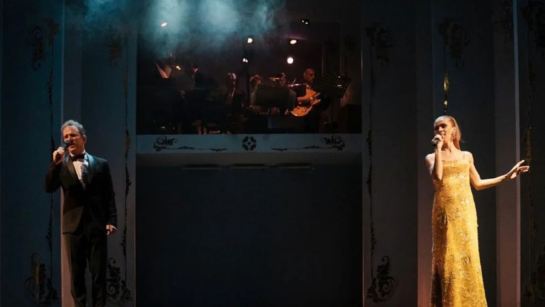 Performers singing at Café de los Angelitos Tango Show in Buenos Aires.