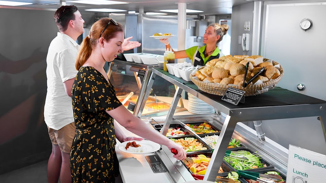 Buffet lunch on Cairns to Green Island cruise with salad and bread options.