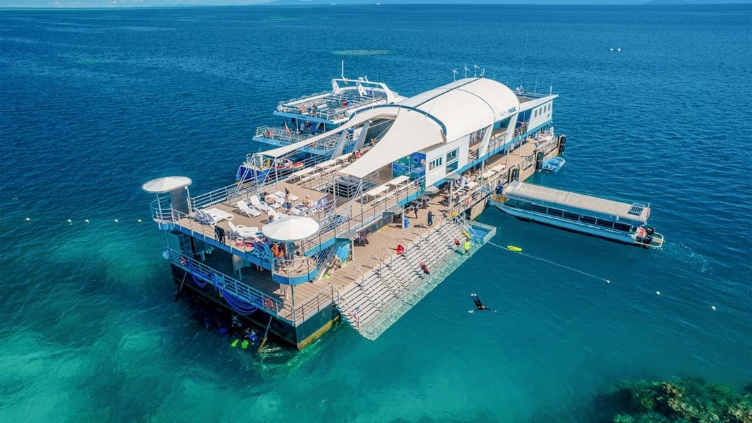 Aerial view of a pontoon with tourists in the Great Barrier Reef, Australia.