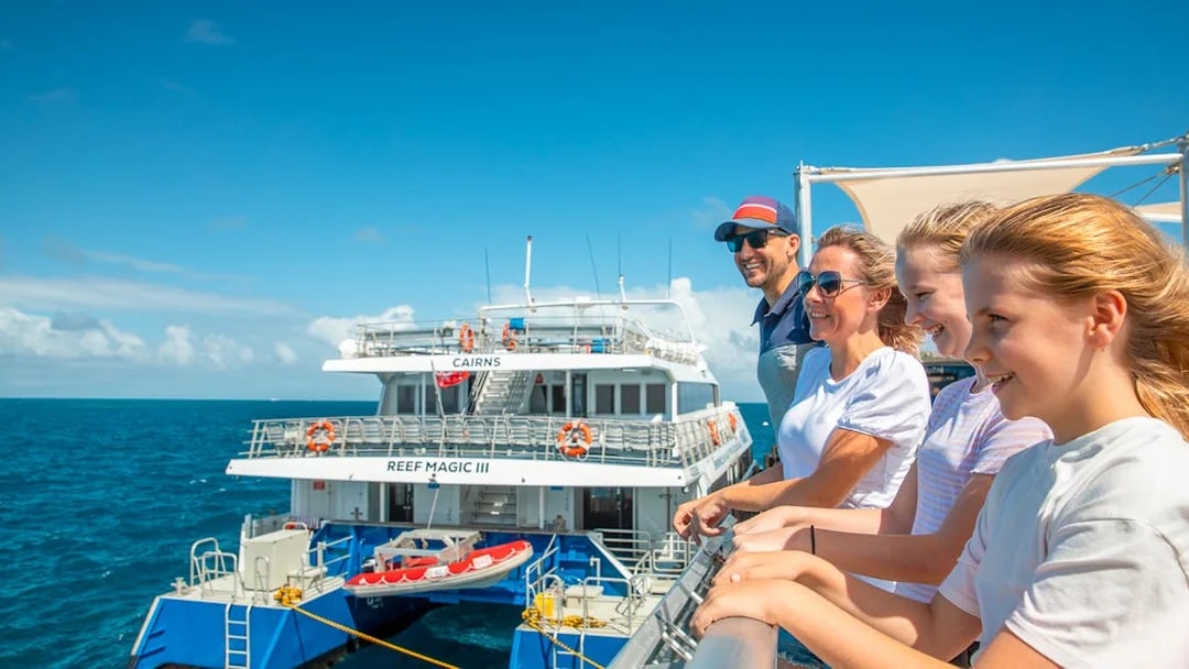 Tourists on a pontoon enjoying a cruise from Cairns to the Great Barrier Reef.