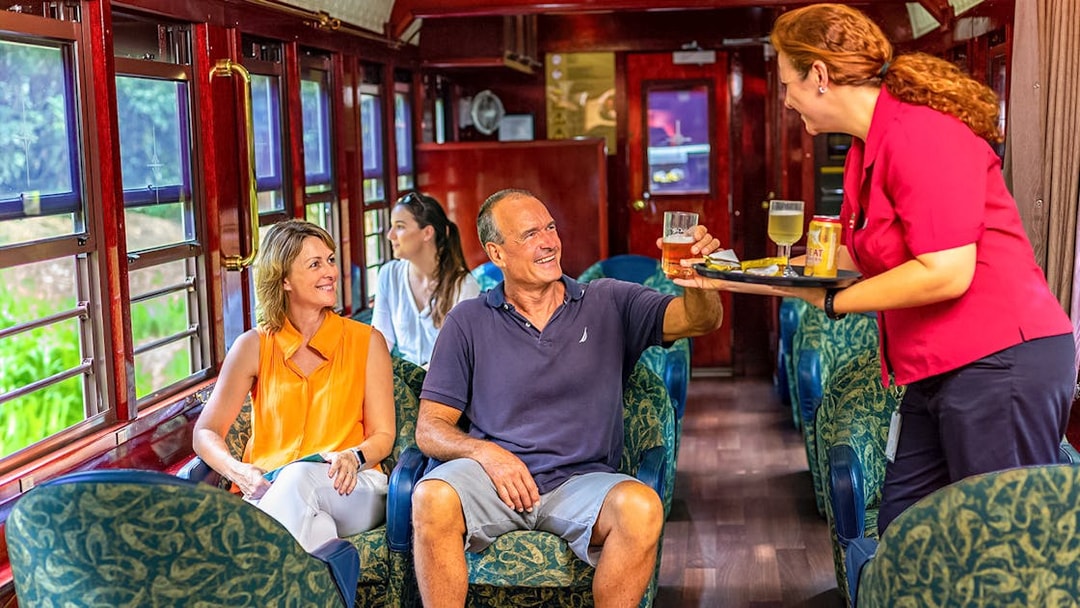 Passengers enjoying drinks on Gold Class, Kuranda Scenic Railway.