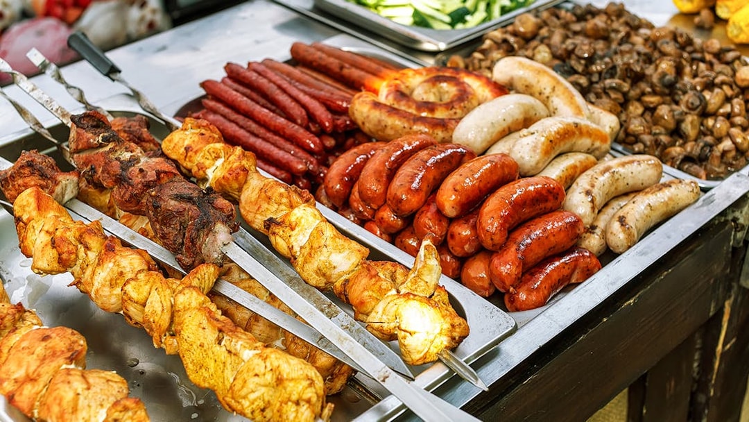 Assorted grilled meats and sausages at a buffet in Kuranda.