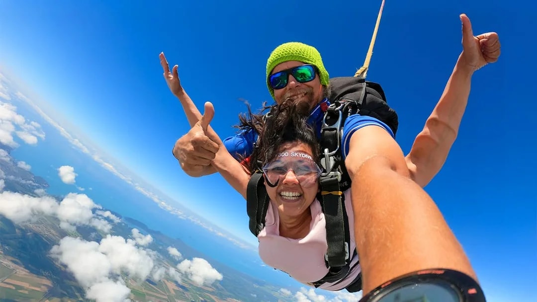 Tandem skydive over Cairns with ocean and landscape views.