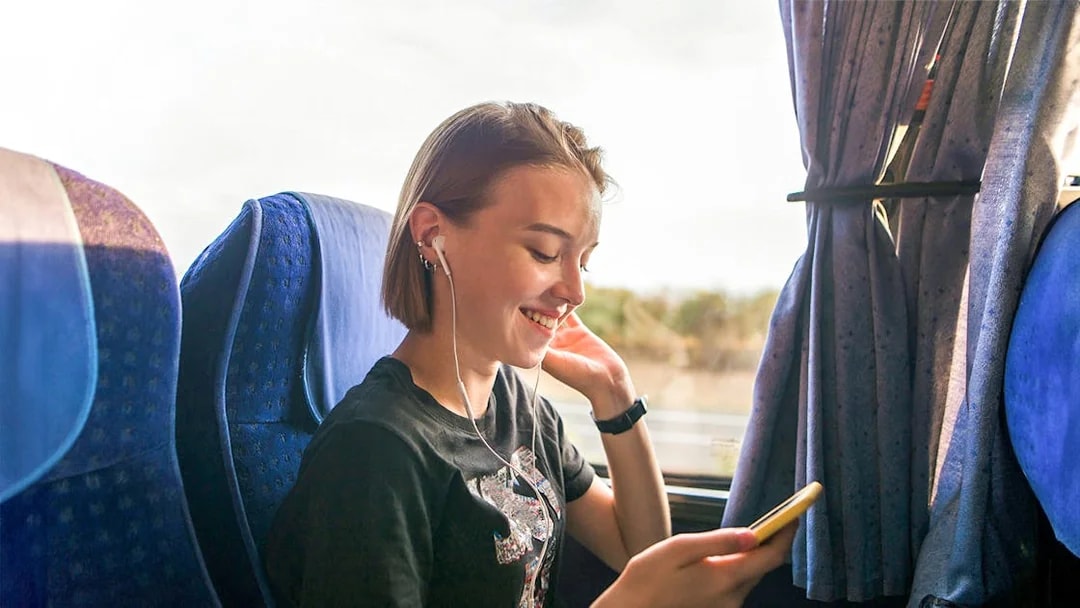 Traveler enjoying a bus ride to Cairo's Tutankhamun Exhibition and Grand Egyptian Museum.