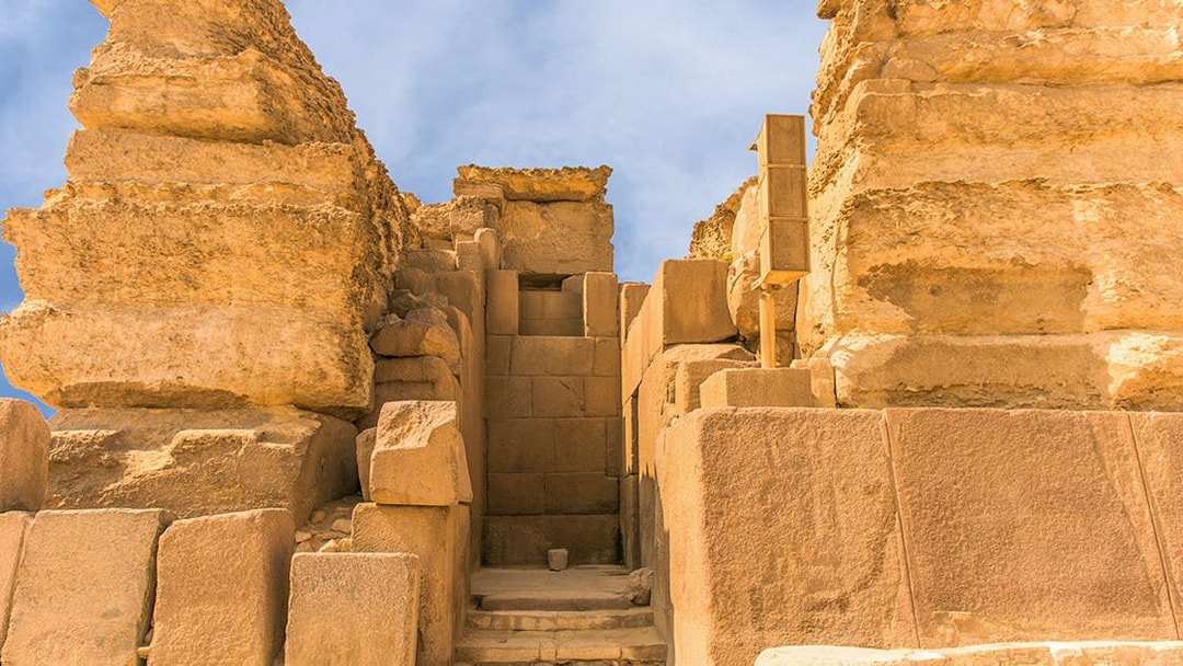Entrance to the Giza Pyramids complex, showcasing ancient stone architecture.
