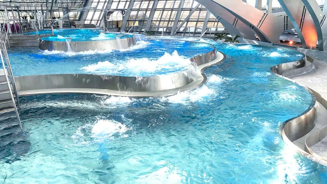 Thermal pools with modern architecture at Caldea spa complex, Andorra.