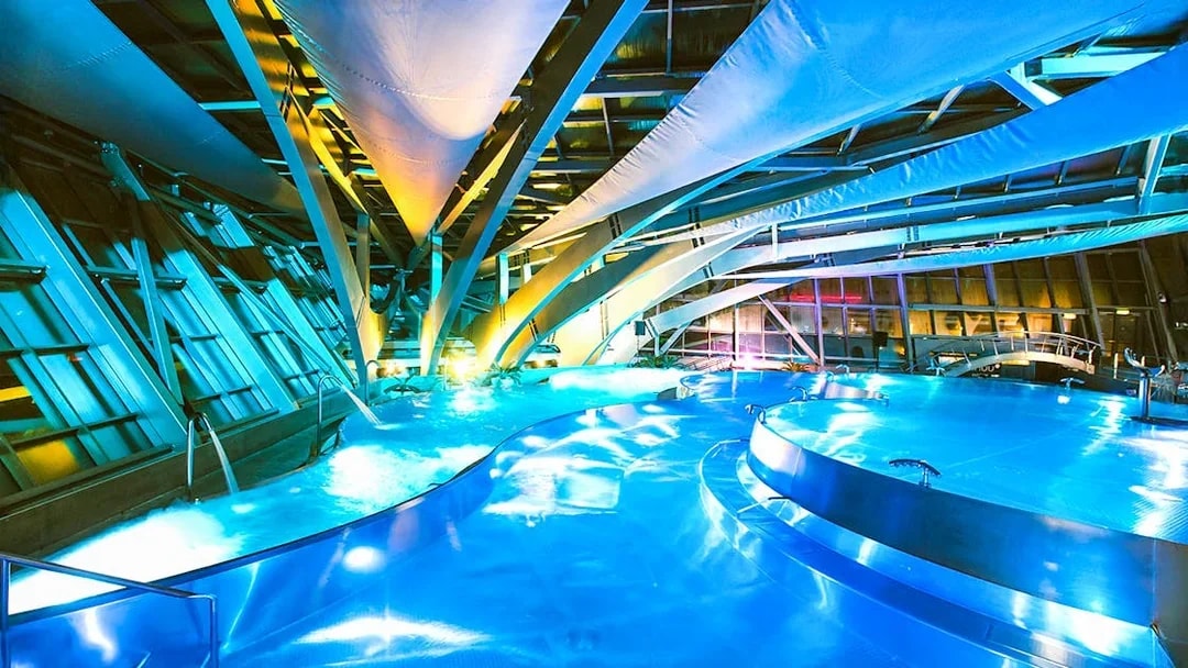Caldea spa interior with illuminated pools and modern architecture in Andorra.
