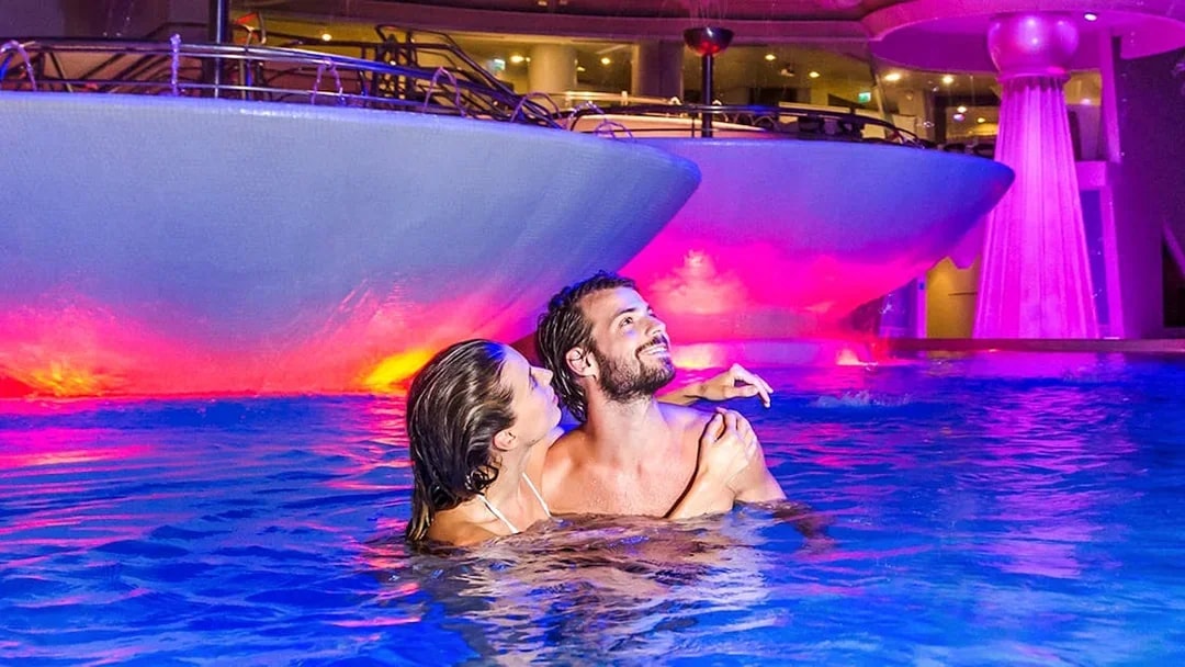 Visitors enjoying thermal pools at Caldea spa, Escaldes-Engordany, Andorra.