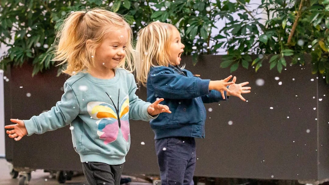 Children playing with bubbles at California Academy of Sciences.