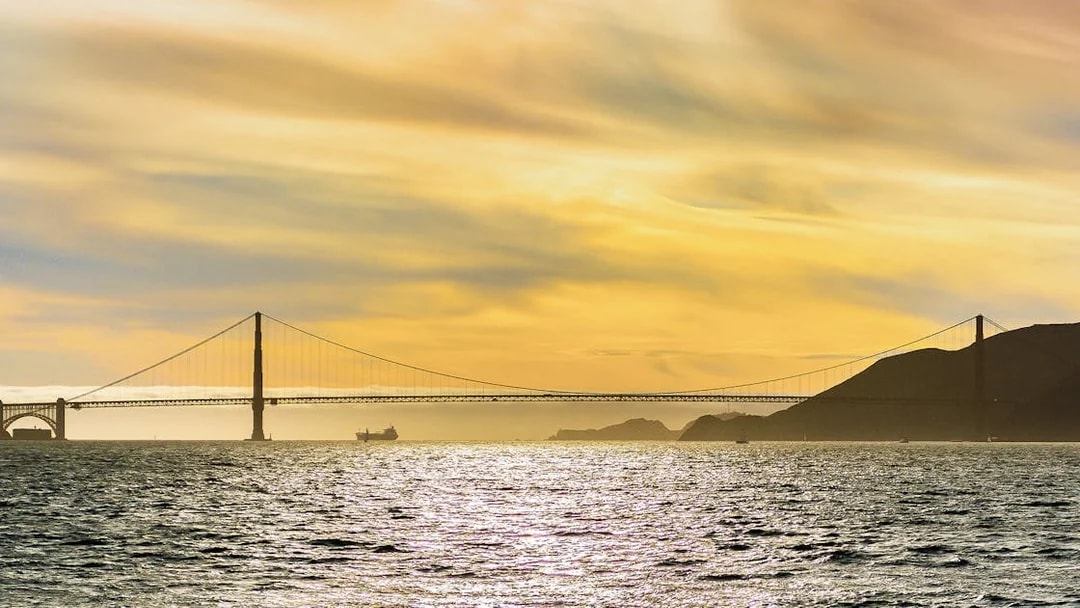 Golden Gate Bridge at sunset viewed from California Sunset Cruise.