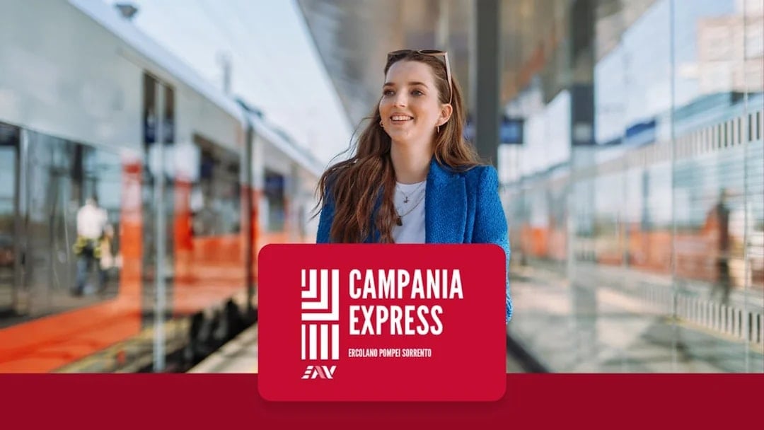 Train platform at Naples Porta Nolana with Campania Express sign.