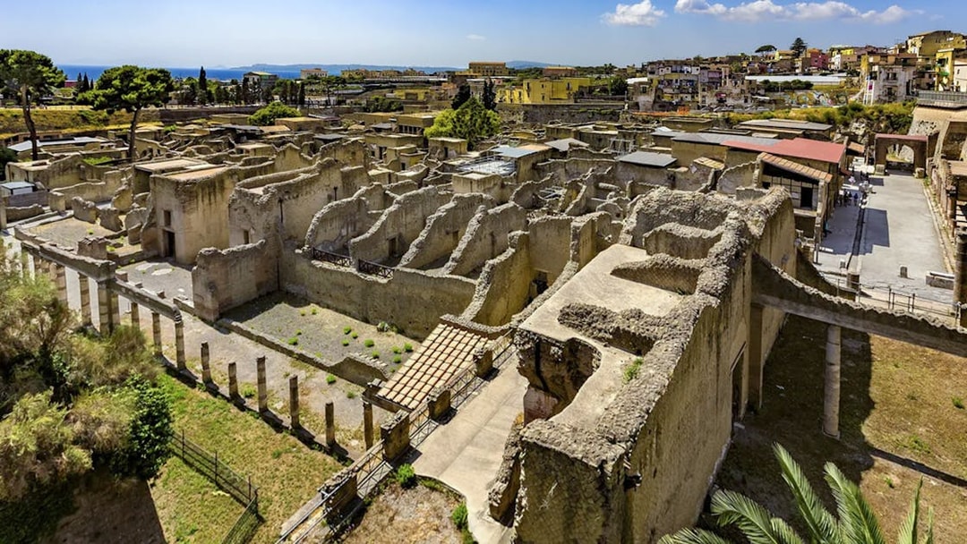 Ancient ruins of Herculaneum with surrounding landscape, view from above.
