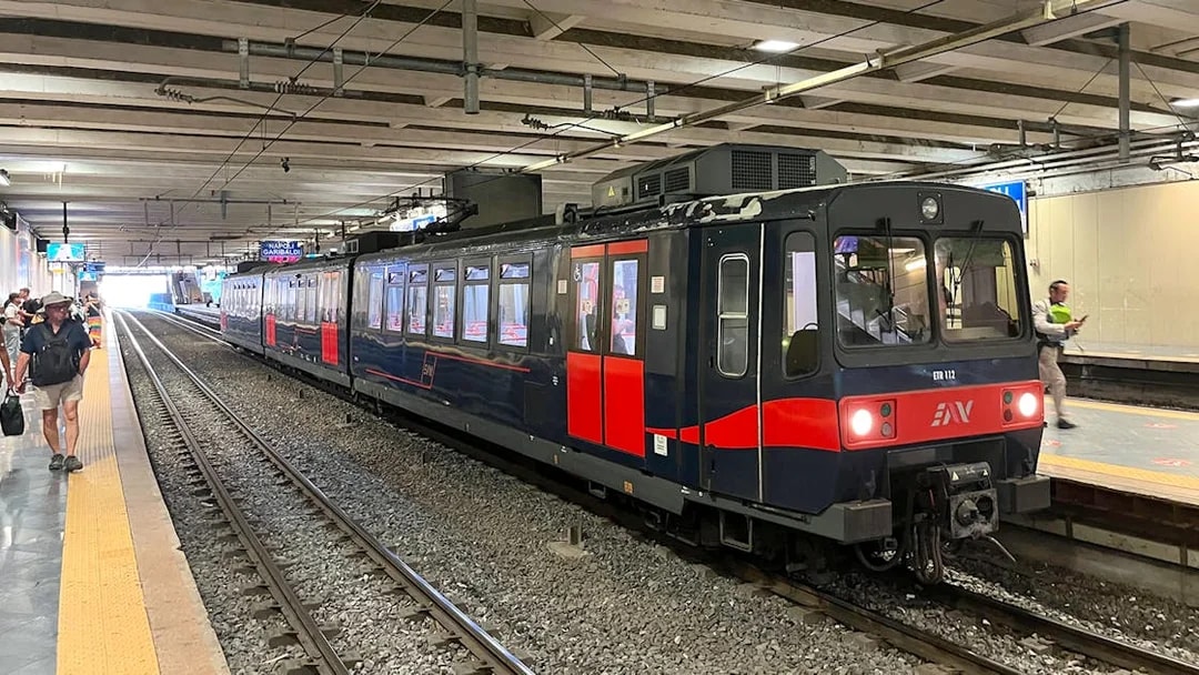 Campania Express train at Napoli Garibaldi station platform.