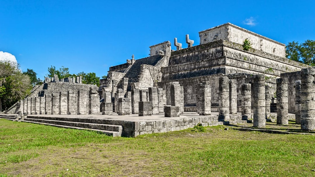 Temple of the Warriors at Chichen Itza, Yucatan, Mexico, with stone columns and steps.