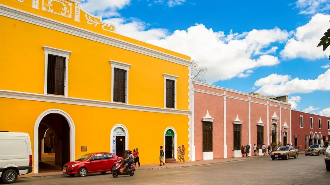Colorful colonial buildings on a street in Valladolid, Mexico.