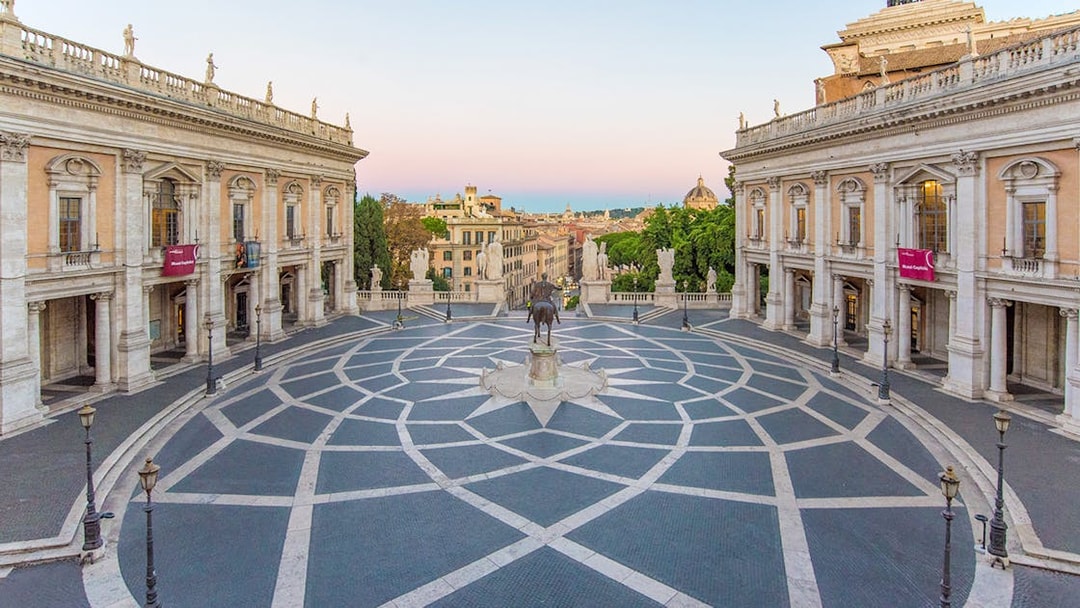 Piazza del Campidoglio in Rome with geometric paving and surrounding historic buildings.