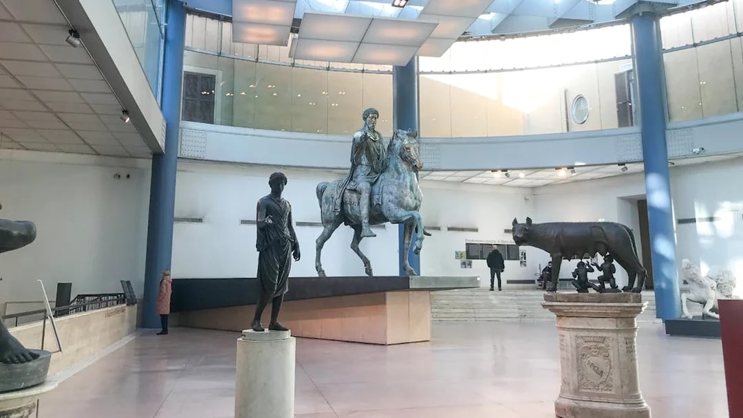 Capitoline Museums statues including Marcus Aurelius on horseback and the Capitoline Wolf in Rome.
