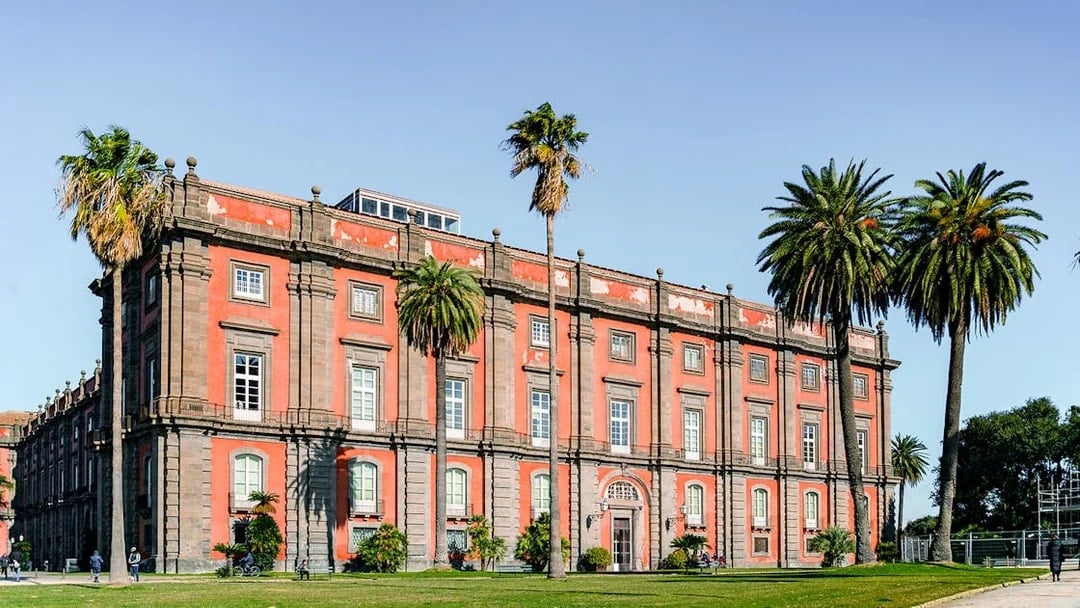 Capodimonte Museum exterior with palm trees, Naples, Italy.