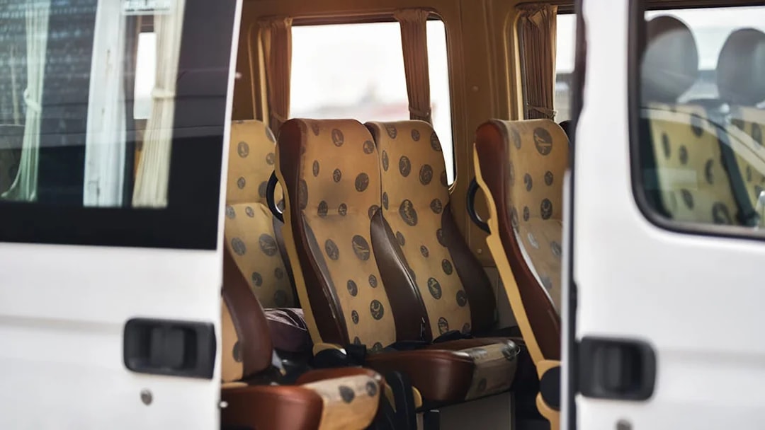 Cappadocia airport shuttle interior with passenger seats.