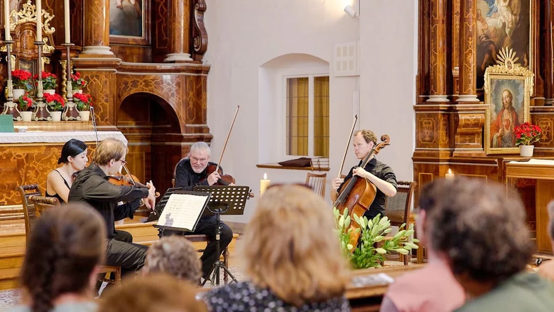 Classical musicians performing at Minoritenkirche, Vienna concert.