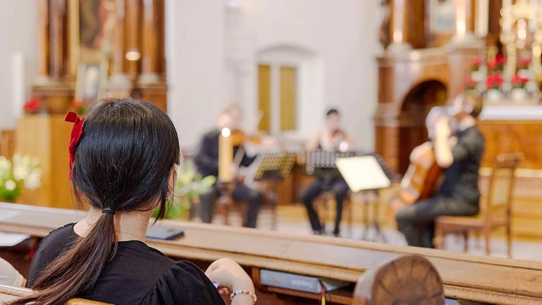 Audience watching a classical concert at Minoritenkirche, Vienna.
