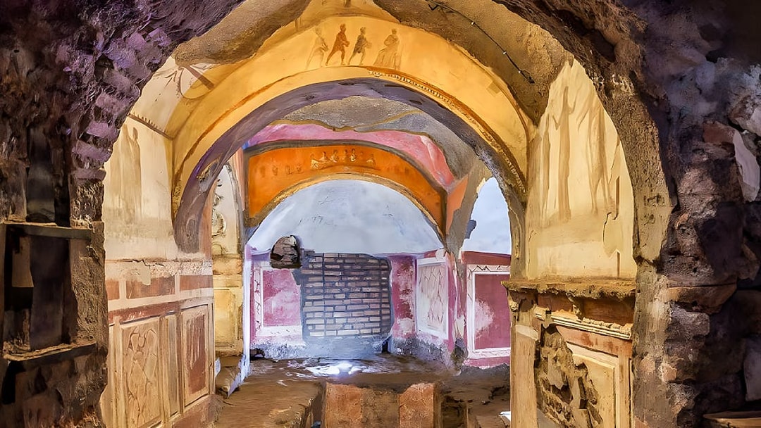 Catacombs passage with frescoes, Rome guided tour.