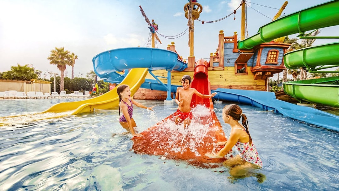 Children playing on water slides at Caribe Aquatic Park.