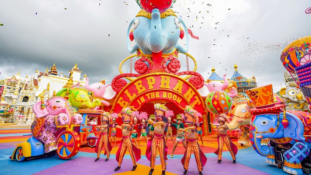 Performers in colorful costumes at Elephant in the Room, Carnival Magic, Phuket.
