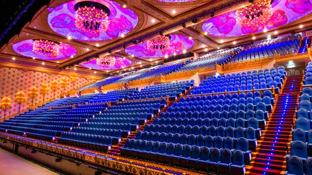 Grand theater seating with ornate ceiling at Carnival Magic Phuket.
