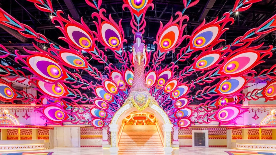 Peacock-themed entrance at Carnival Magic Park in Phuket.