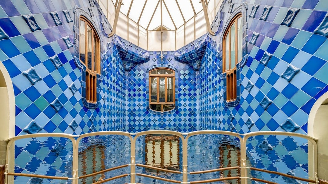 Casa Batlló interior with blue tiled walls and wooden windows, Barcelona.