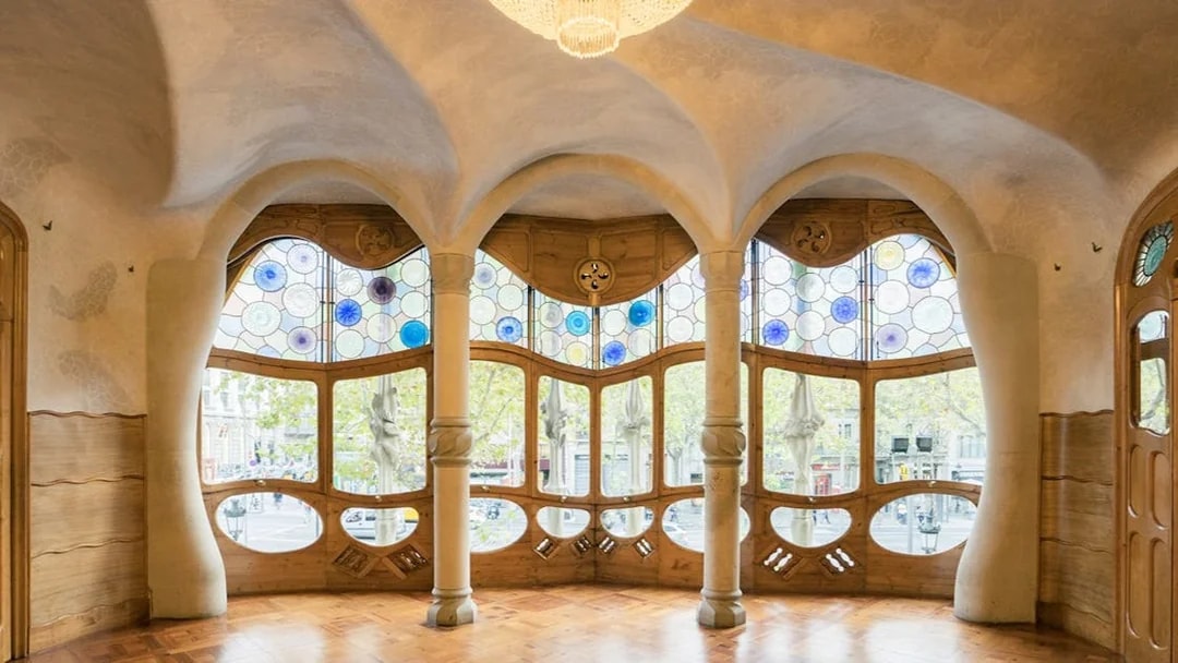 Casa Batlló interior with stained glass windows and unique architectural design in Barcelona.
