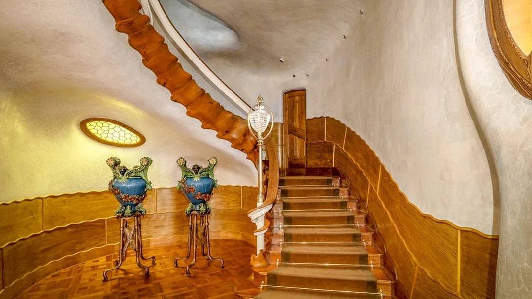 Casa Batlló interior staircase with ornate vases, Barcelona.