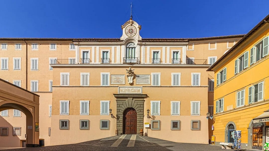 Facade of Castel Gandolfo with clock tower, Italy.
