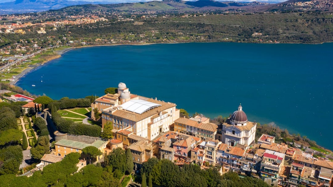 Aerial view of the Papal Palace of Castel Gandolfo overlooking Lake Albano near Rome, Italy.