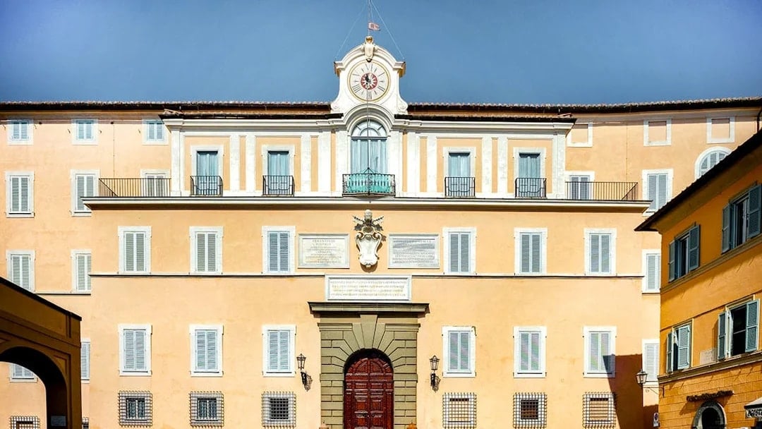 Castel Gandolfo facade with clock tower in Vatican City.