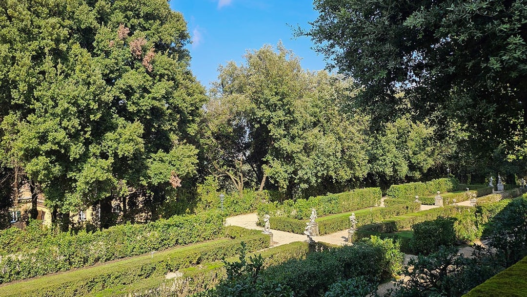 Castel Gandolfo's Apostolic Palace Secret Garden with manicured hedges and statues.