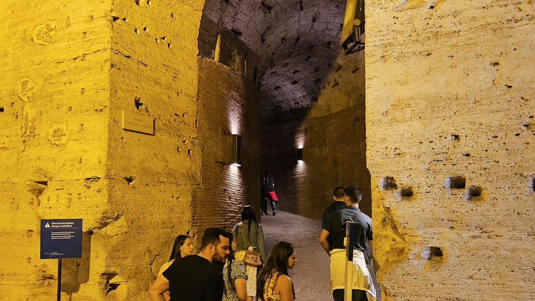 Visitors exploring the ancient corridors of Castel Sant'Angelo in Rome.