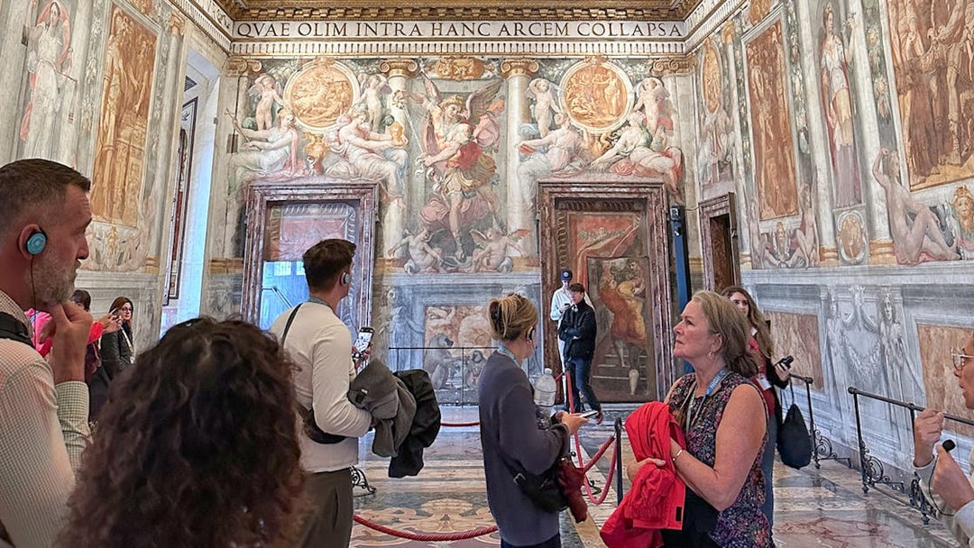 Visitors exploring frescoes inside Castel Sant'Angelo, Rome.