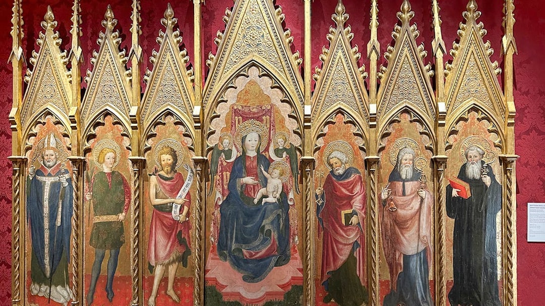 Medieval religious artwork inside Castel Sant'Angelo, Rome, depicting saints and Madonna.