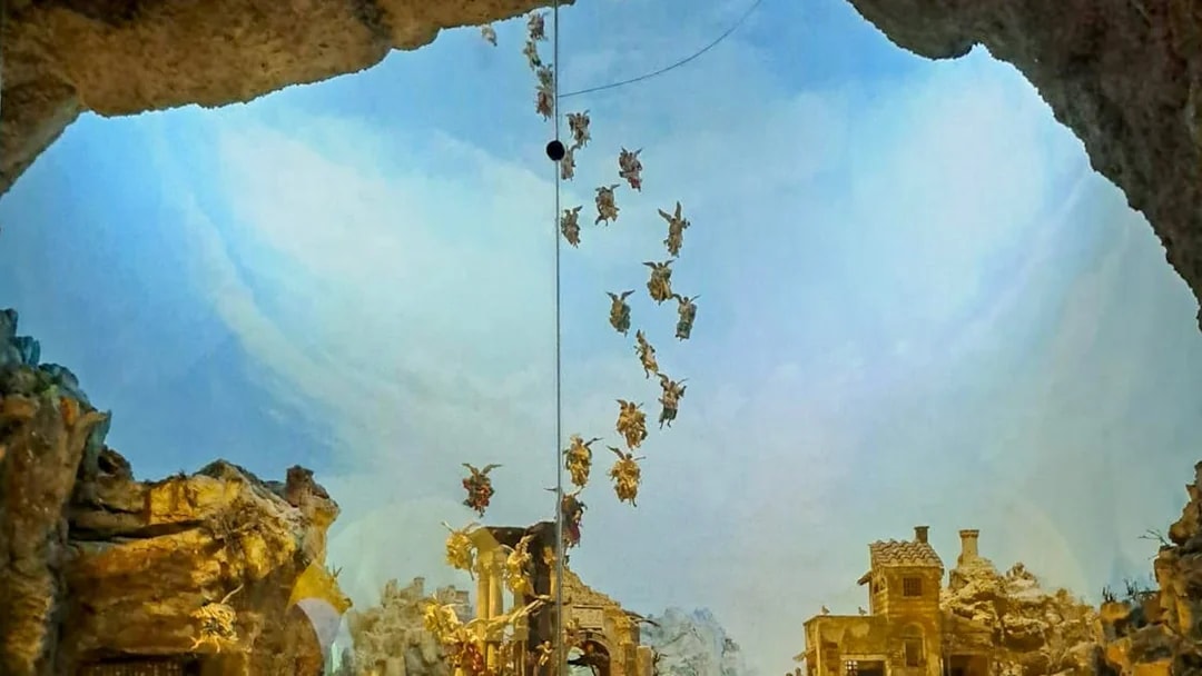 Nativity scene with angels above a village, part of Castel Sant'Elmo and Certosa di San Martino tour in Naples.